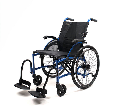 Strongback Comfort Flip wheelchair from the front three-quarter in blue, with both armrests down, the swing-away legrests and footplates deployed and the front castors visible