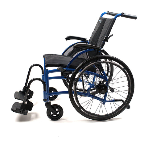 Strongback Comfort Flip wheelchair seen from the side in blue, showing the contoured backrest built into the frame, the desk-length flip-back armrest, a 24 inch quick-release rear wheel with hand rim and a swing-away legrest